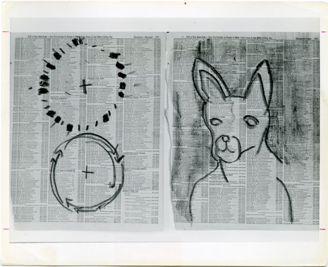 Two charcoal drawings on newspaper: the drawing on the left is of two circles on top of each other with plus symbols in the center; the drawing on the right is of a dog's head.