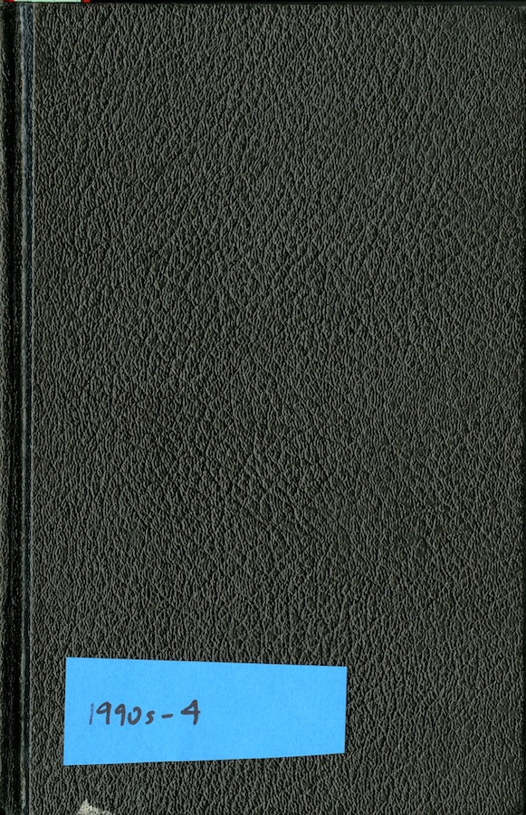 Cover of a notebook with a sticky note that reads: “1990s - 4”