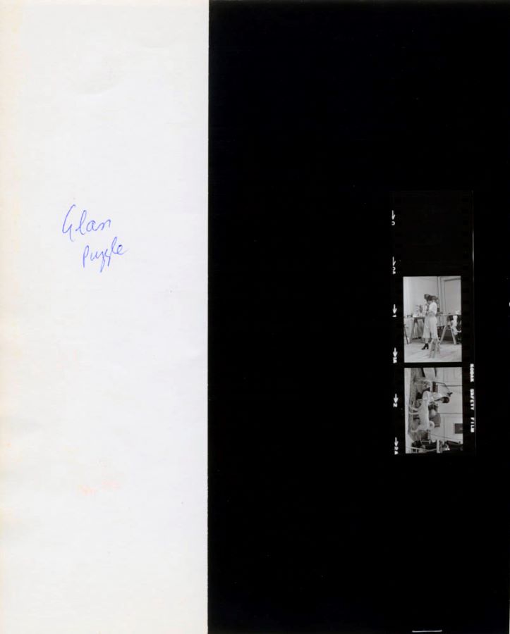 A photographic contact strip, showing different angles of Jonas’s performance, on top of a notebook with the words “Glass Puzzle” written on it