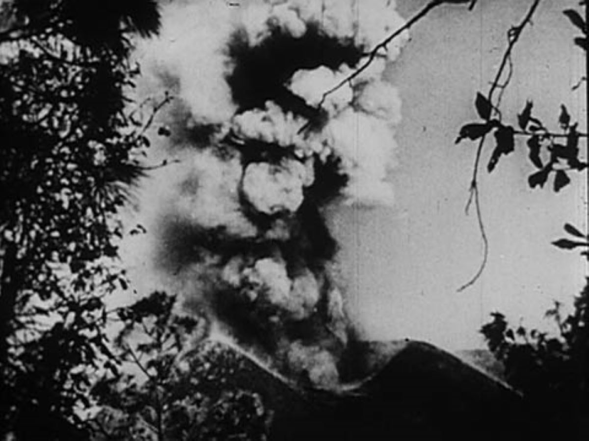 Film still of a volcano erupting