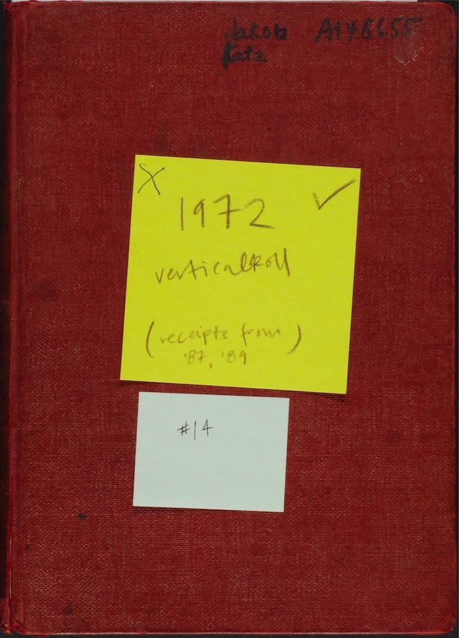 Cover of a notebook with writing in the top right corner and two sticky notes. Top right corner reads “Jakob Katz A148655.” Yellow sticky has a ‘x’ and a check mark and reads: “1972 vertical roll (receipts from ‘87, ‘89).” Blue sticky reads: “#14.”